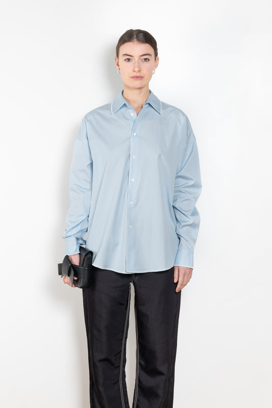 The Overlock Uniform Shirt by 6397 is a signature oversized cotton shirt with a contrasted overlock stitch detail and a subtle dropped shoulder