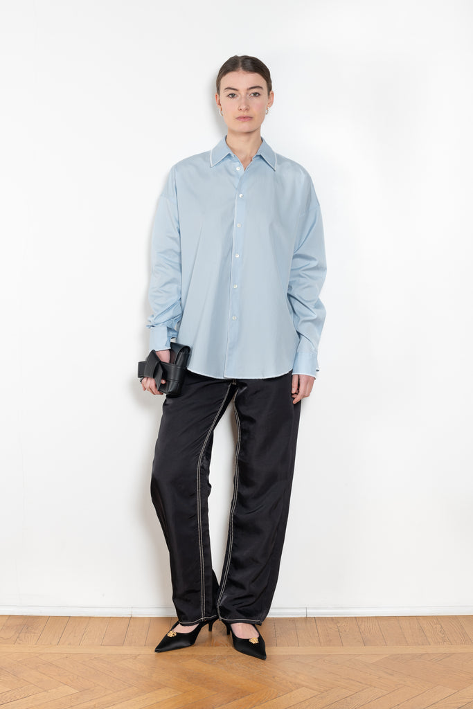 The Overlock Uniform Shirt by 6397 is a signature oversized cotton shirt with a contrasted overlock stitch detail and a subtle dropped shoulder