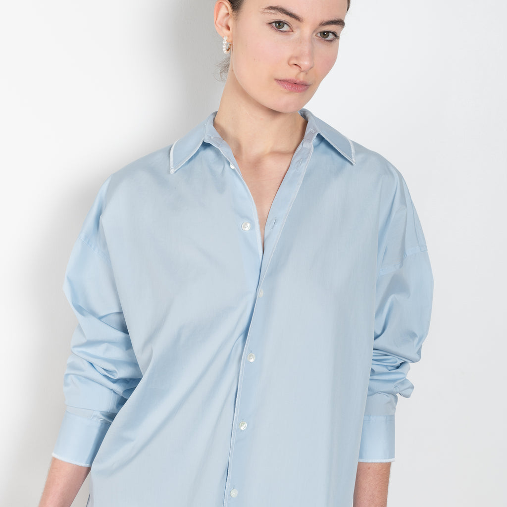 The Overlock Uniform Shirt by 6397 is a signature oversized cotton shirt with a contrasted overlock stitch detail and a subtle dropped shoulder