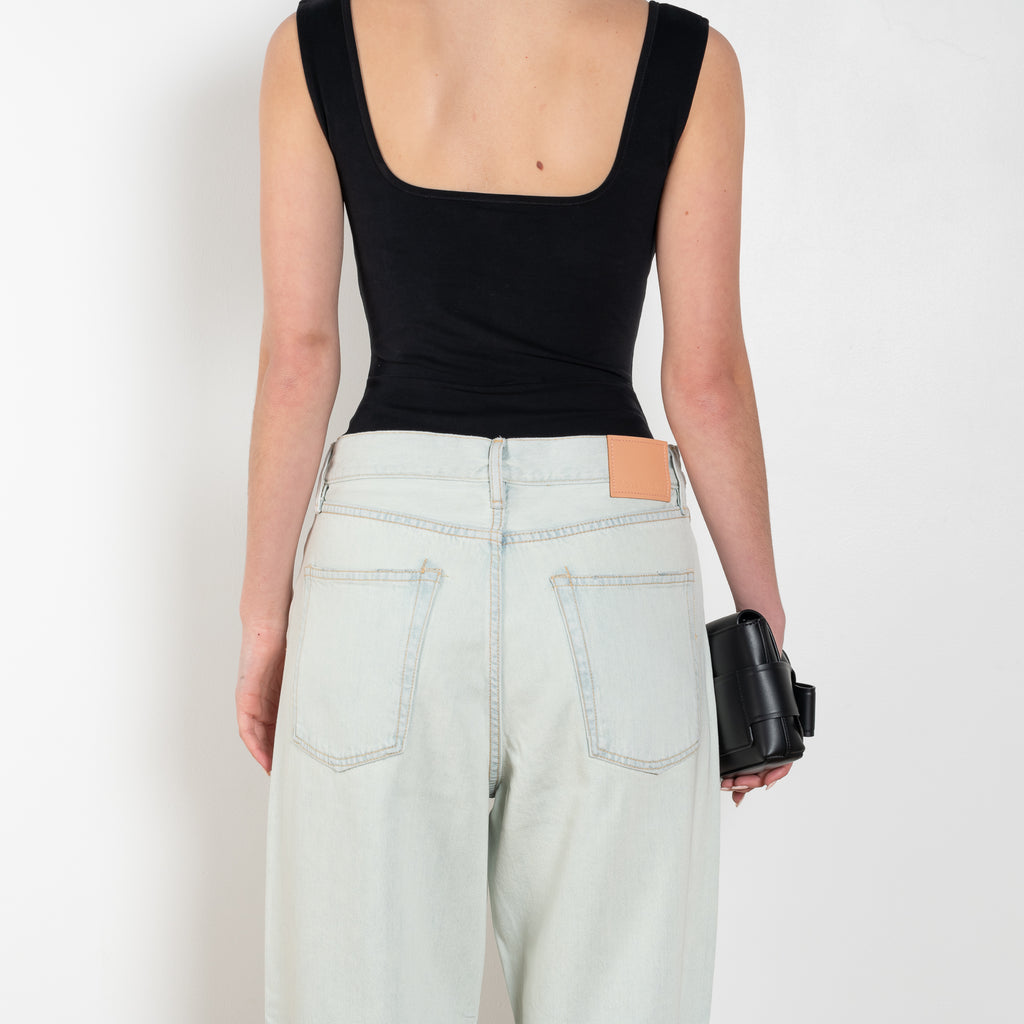 The 1981F Jeans by Acne Studios are cut to a loose fit with a low waist, wide leg and long length