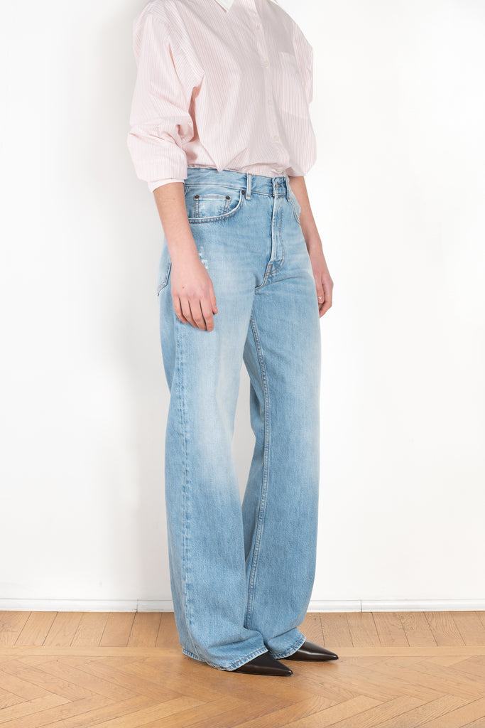 The 2021 Loose Fit Jeans by Acne Studios are cut to a loose fit with mid-waist, wide leg and long length