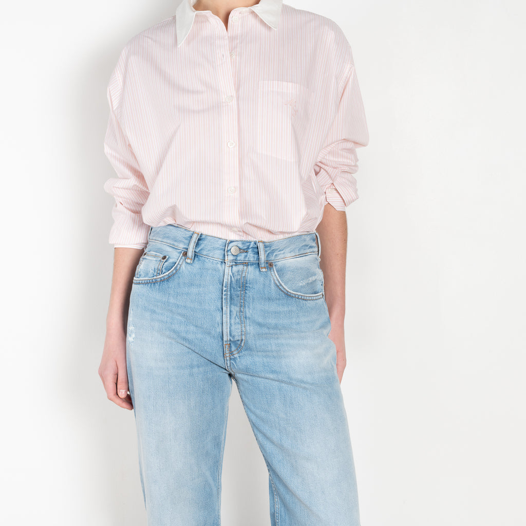 The 2021 Loose Fit Jeans by Acne Studios are cut to a loose fit with mid-waist, wide leg and long length