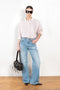 The 2021 Loose Fit Jeans by Acne Studios are cut to a loose fit with mid-waist, wide leg and long length