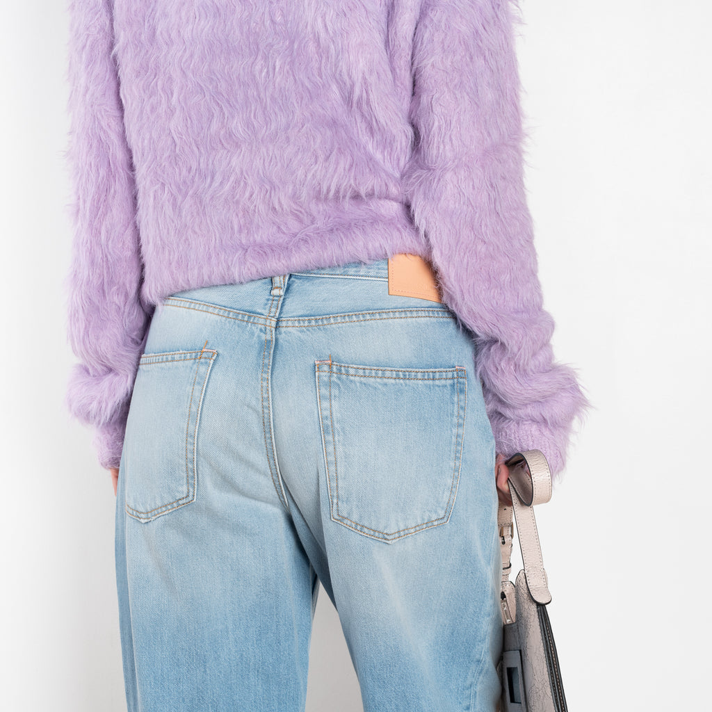 The 1981F Jeans by Acne Studios are cut to a loose fit with a low waist, wide leg and long length