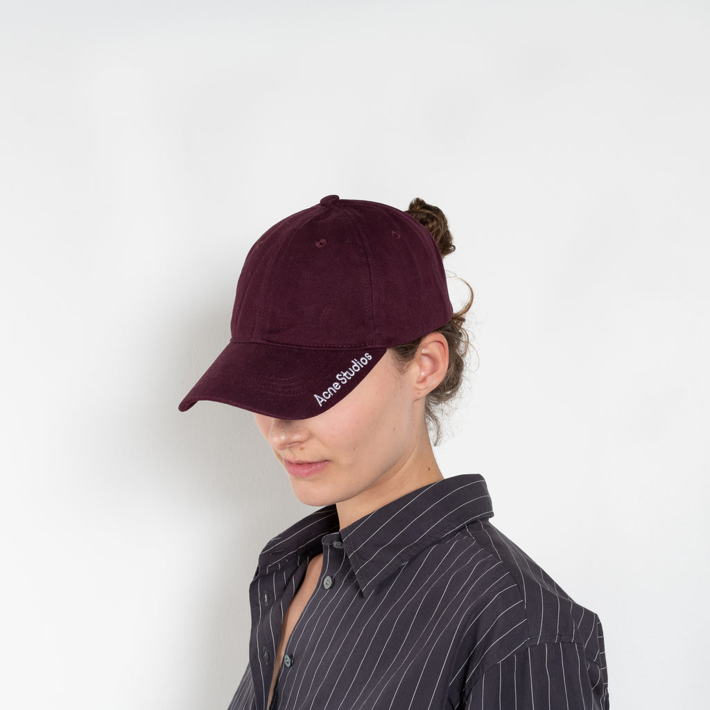 The Logo Cap by Acne Studios is a baseball cap with a seasonal Acne Studios embroidered logo