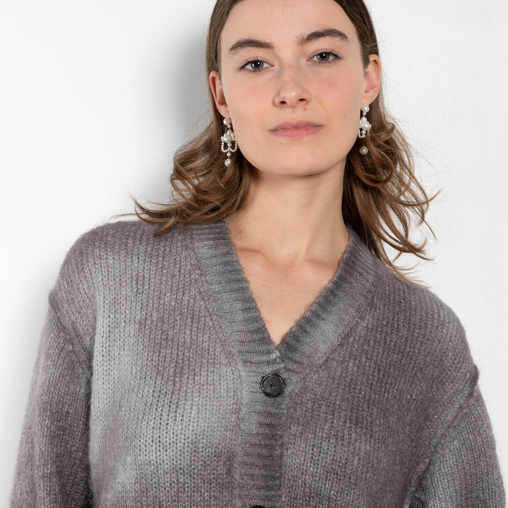 The Spray Finished Cardigan by Acne Studios is crafted from a wool mohair blend with a distinct sprayed finish