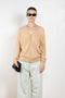 The Vneck Cardigan 029 by Acne Studios is a signature cardigan with a Face Logo patch on the chest