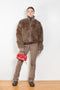 The Furry Jacket by Acne Studios has a bi-coloured furry finish with a ribbed neckline