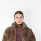 The Furry Jacket by Acne Studios has a bi-coloured furry finish with a ribbed neckline