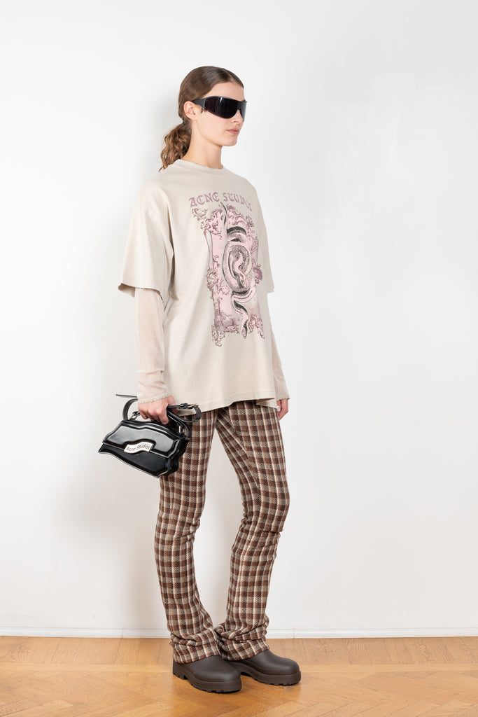 The Layered Tshirt by Acne Studios is a oversized Tee with a seasonal print and layered long sleeves in mesh