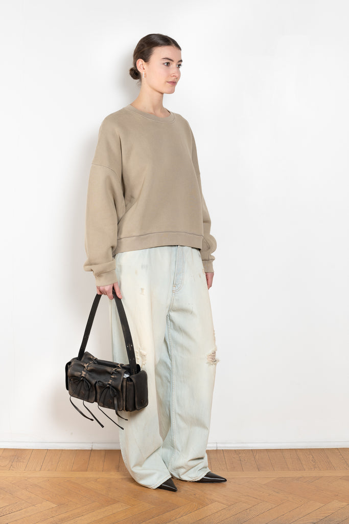 The Logo Patch Sweater by Acne Studios has a relaxed unisex fit