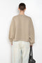 The Logo Patch Sweater by Acne Studios has a relaxed unisex fit