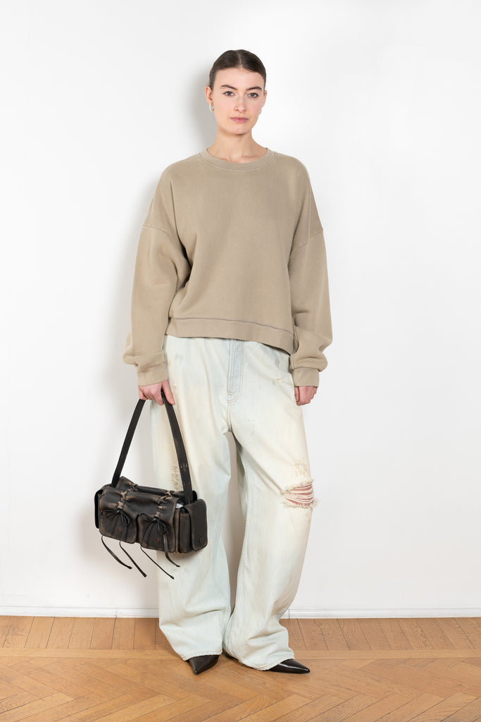 The Logo Patch Sweater by Acne Studios has a relaxed unisex fit