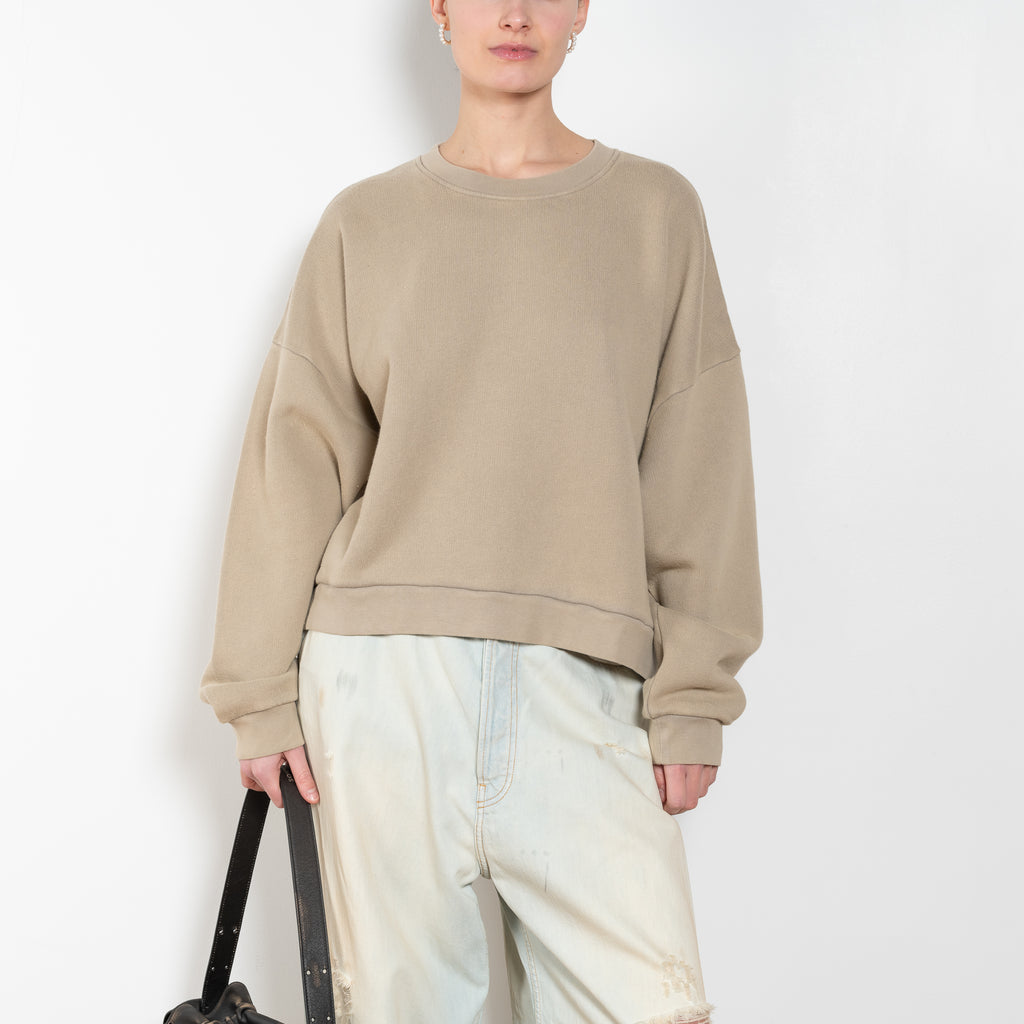 The Logo Patch Sweater by Acne Studios has a relaxed unisex fit