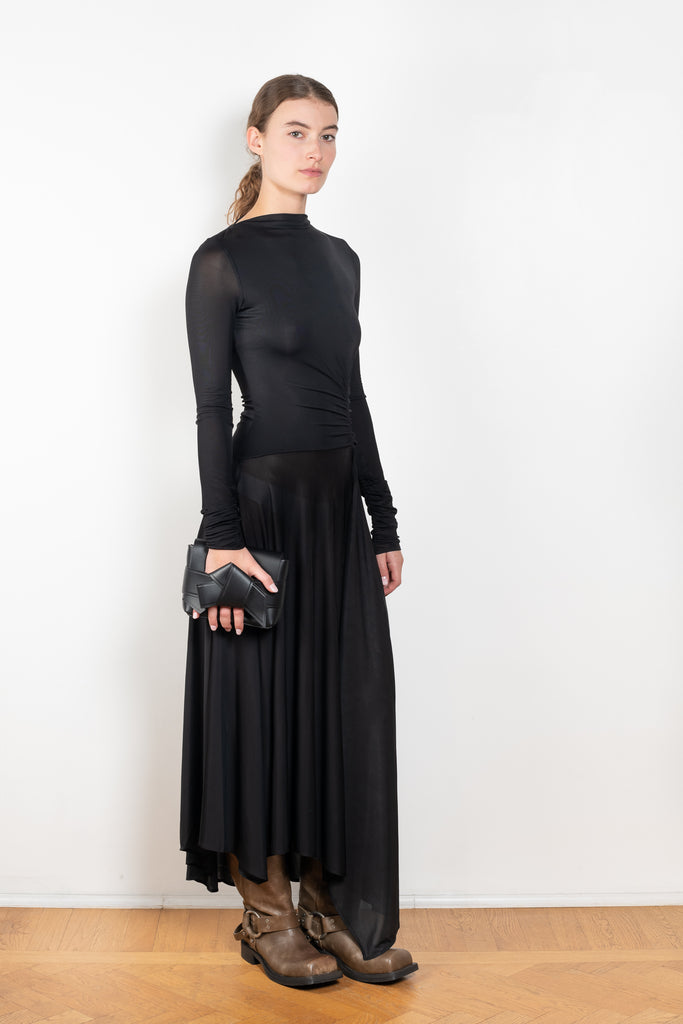 The Open Back Dress by Acne Studios has a fitted top with gathered detailing at the front and sleeves and an open back