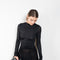 The Open Back Dress by Acne Studios has a fitted top with gathered detailing at the front and sleeves and an open back