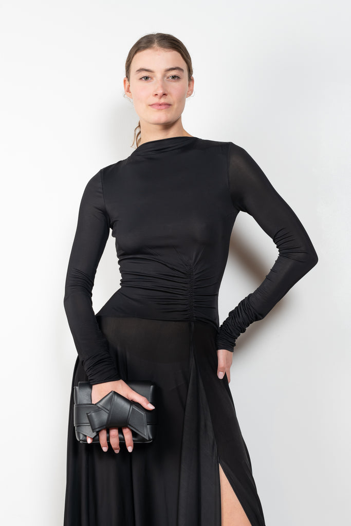 The Open Back Dress by Acne Studios has a fitted top with gathered detailing at the front and sleeves and an open back