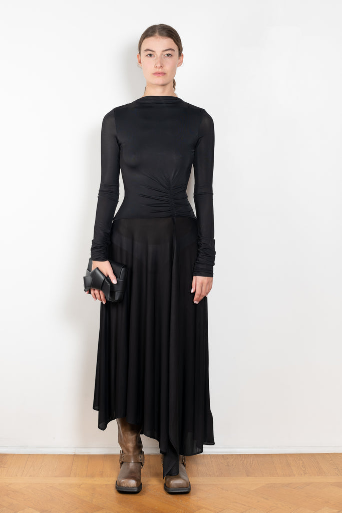 The Open Back Dress by Acne Studios has a fitted top with gathered detailing at the front and sleeves and an open back