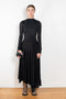 The Open Back Dress by Acne Studios has a fitted top with gathered detailing at the front and sleeves and an open back