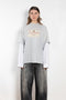 The Layered Print Tee by Acne Studios has a relaxed fit with under-layer mesh long sleeves and distressed neckline