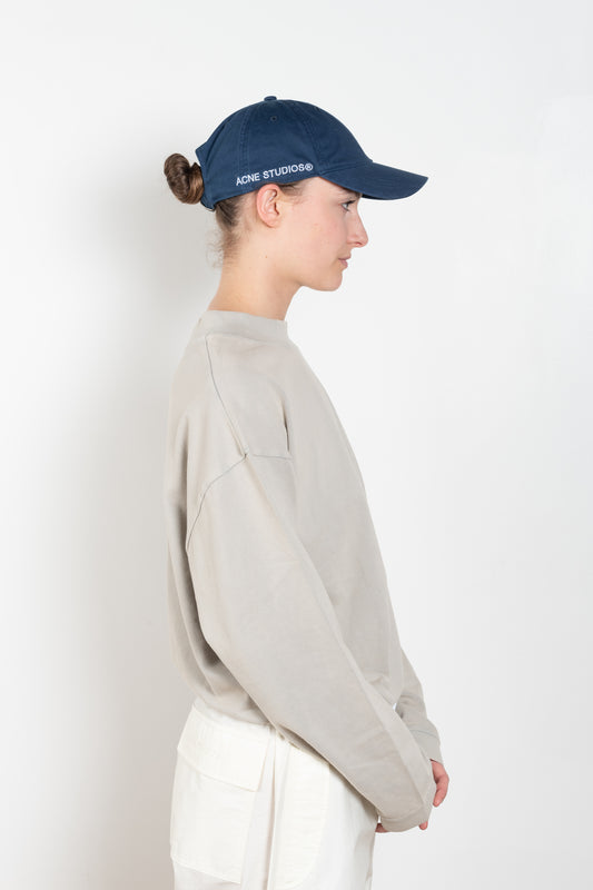 The Cotton Ripstop Cap by Acne Studios is a six-panel baseball cap crafted from ripstop cotton