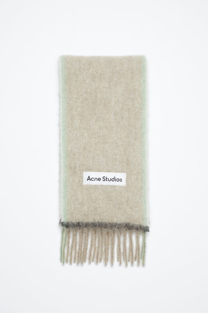 The Wool Mohair Scarf by Acne Studios Fringe is crafted from a rich wool mohair blend, detailed with an Acne Studios embroidered logo label and weaved contrast framing