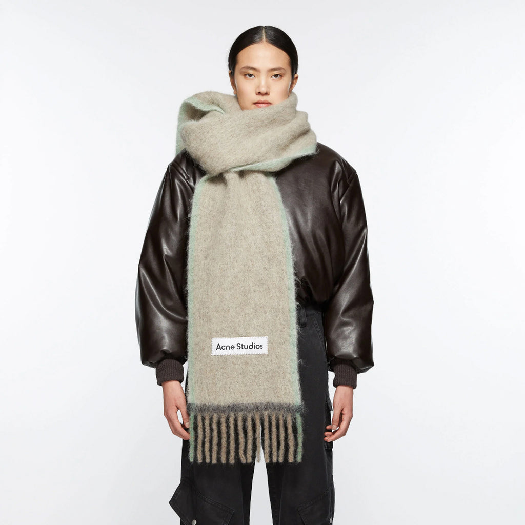 The Wool Mohair Scarf by Acne Studios Fringe is crafted from a rich wool mohair blend, detailed with an Acne Studios embroidered logo label and weaved contrast framing