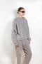 The Hooded Sweater 0019 by Acne Studios is a signature hoodie sweater with a small rubber logo patch on the back