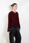 The Mathilde Crop Sweater by Alexandra Golovanoff is a signature V-neck sweater with a relaxed fit