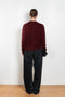 The Mathilde Crop Sweater by Alexandra Golovanoff is a signature V-neck sweater with a relaxed fit