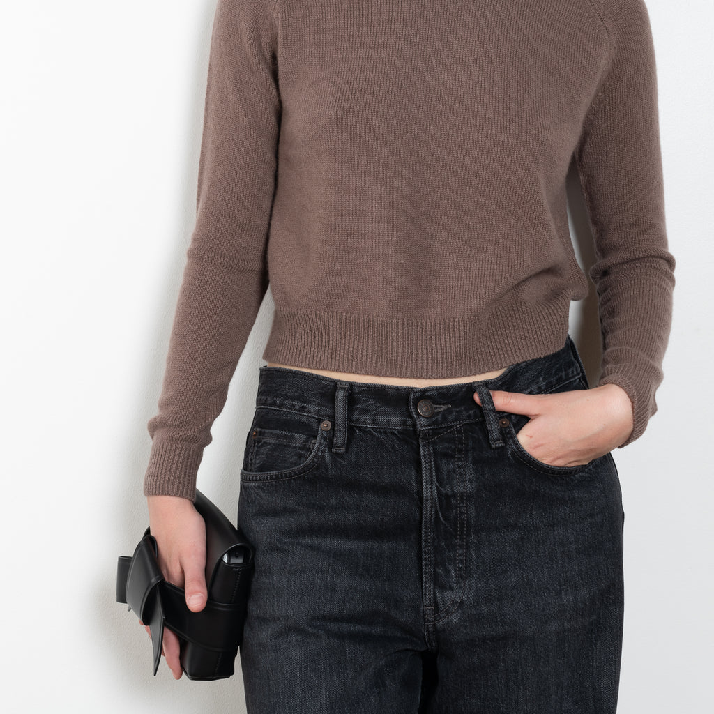 The Mini Mila sweater by Alexandra Golovanoff is a signature round neck sweater with a shorter cut for a fitted look