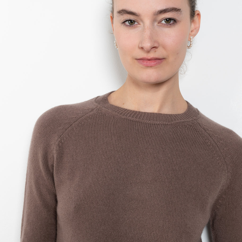 The Mini Mila sweater by Alexandra Golovanoff is a signature round neck sweater with a shorter cut for a fitted look