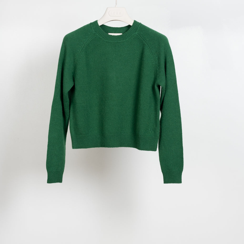 The Mini Mila Sweater by Alexandra Golovanoff is a signature round neck sweater with a shorter cut for a fitted look