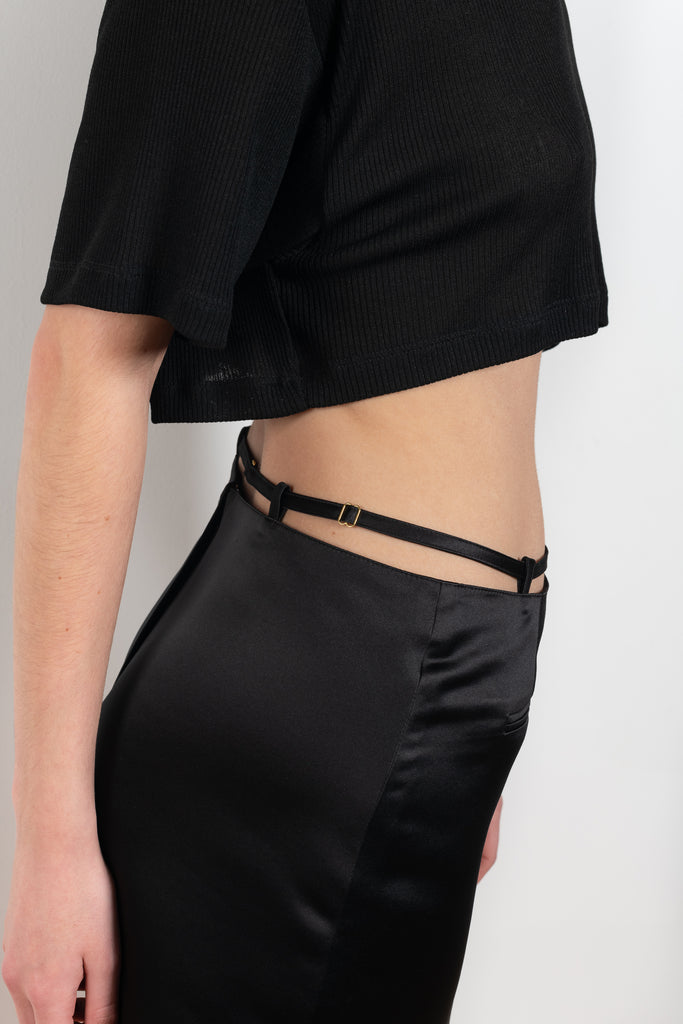 The Keren Mini Skirt by Anna October is a satin mini skirt with a lingerie inspired straps in the waist