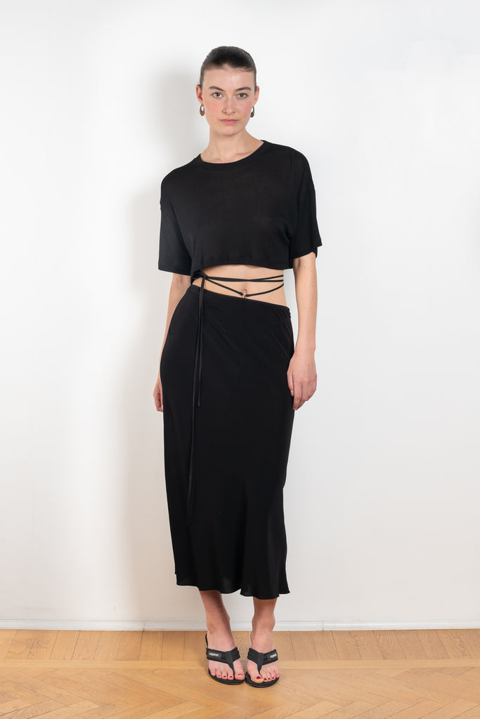 The Voleta Midi Skirt by Anna October is a signature summer skirt with a bias cut and delicate straps on the hips