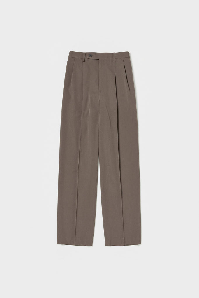 The Light Wool Slacks by Auralee is a relaxed trouser with pleats in a wool Gabardine fabric