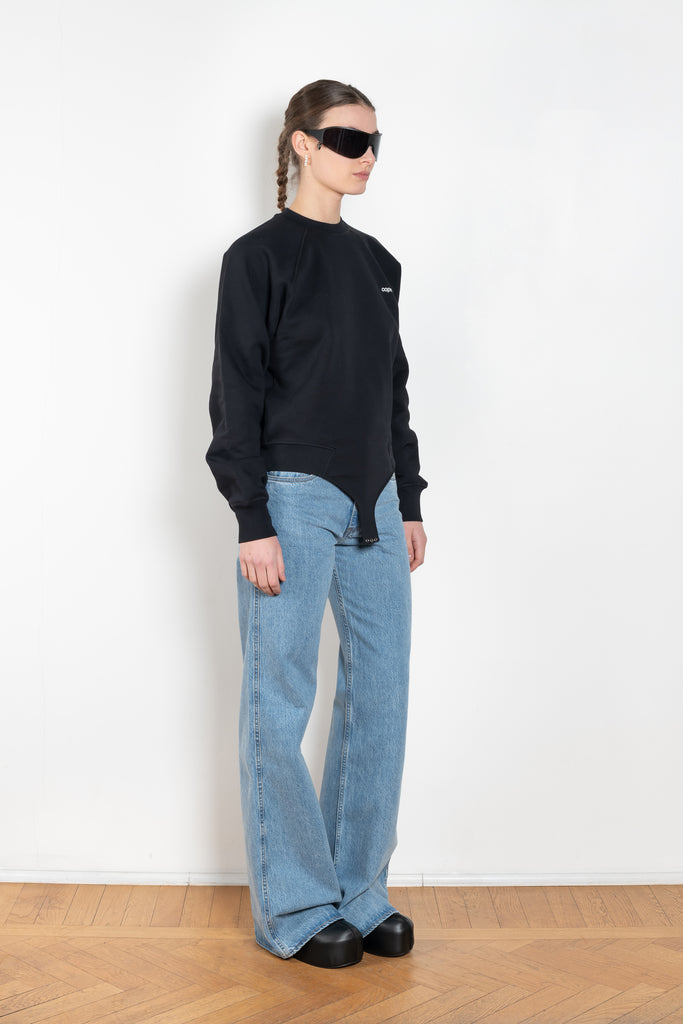 The Sweatshirt Body by Coperni is a signature crewneck sweater with a small slanted Coperni Logo on the front and body details