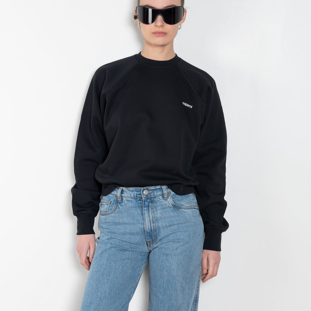 The Sweatshirt Body by Coperni is a signature crewneck sweater with a small slanted Coperni Logo on the front and body details