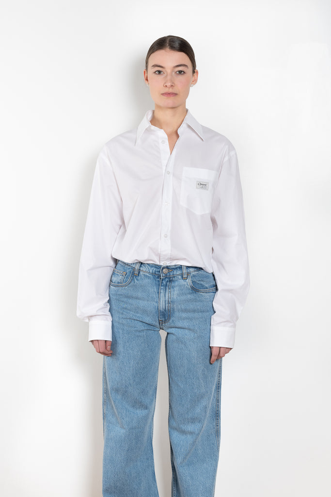 The Body Poplin Shirt by Coperni is a crisp cotton shirt with logo patch and body details