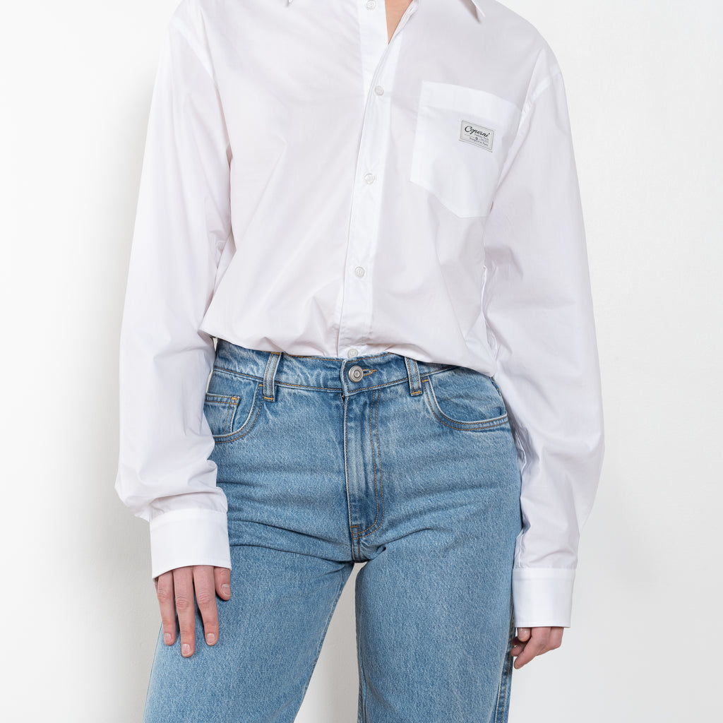 The Body Poplin Shirt by Coperni is a crisp cotton shirt with logo patch and body details