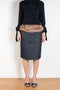 The Faux Fur Hybrid Denim Skirt by Coperni is a denim skirt with an optic low waist and faux fur waistband at the front