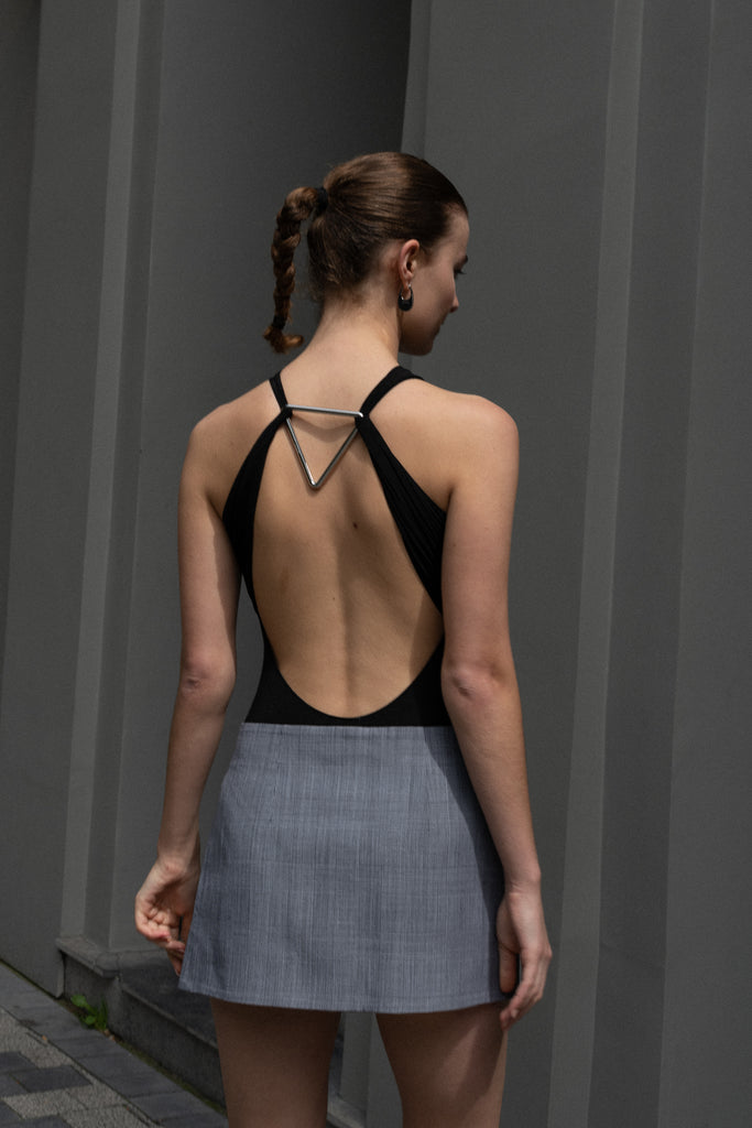 The Triangle Body by Coperni is a fine jersey body with a triangle cut-out at the back