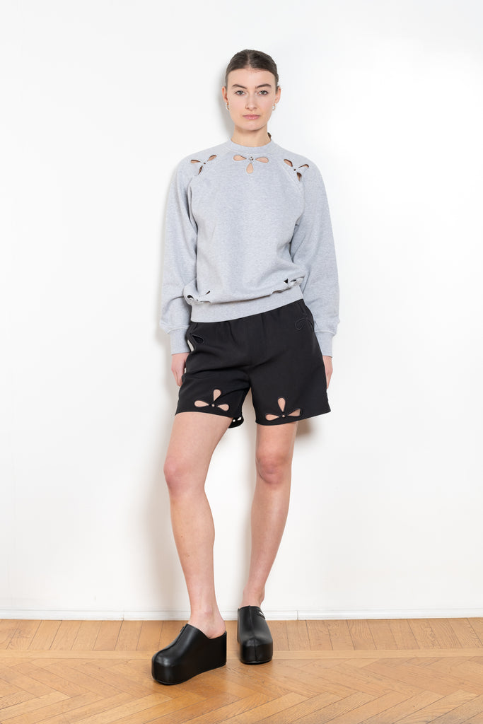 The Petal Embroidered Shorts by Coperni are boxer inspired shorts with a coperni logo patch and seasonal petal cut-outs