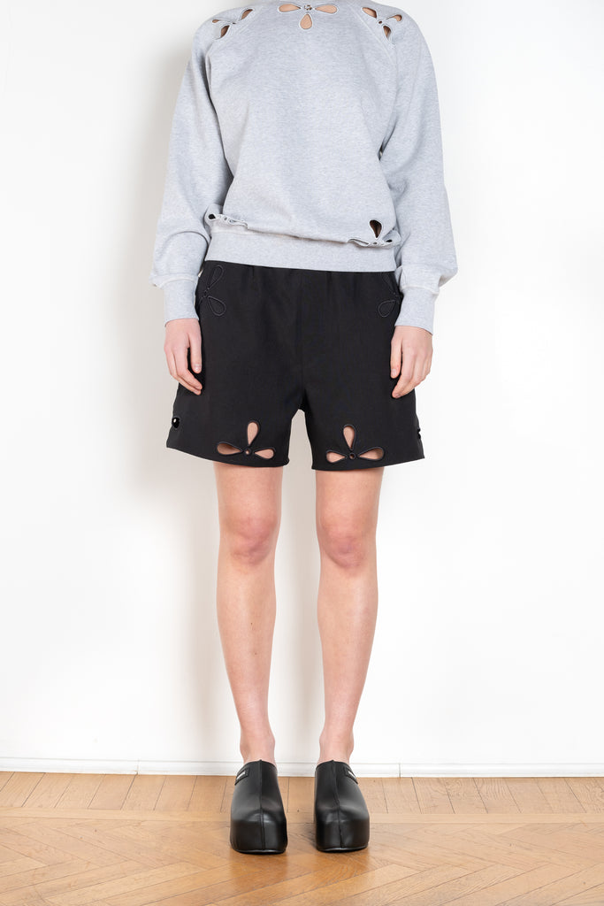 The Petal Embroidered Shorts by Coperni are boxer inspired shorts with a coperni logo patch and seasonal petal cut-outs