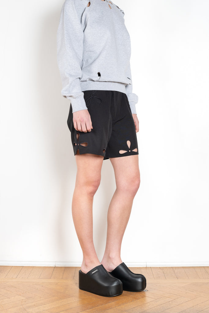 The Petal Embroidered Shorts by Coperni are boxer inspired shorts with a coperni logo patch and seasonal petal cut-outs