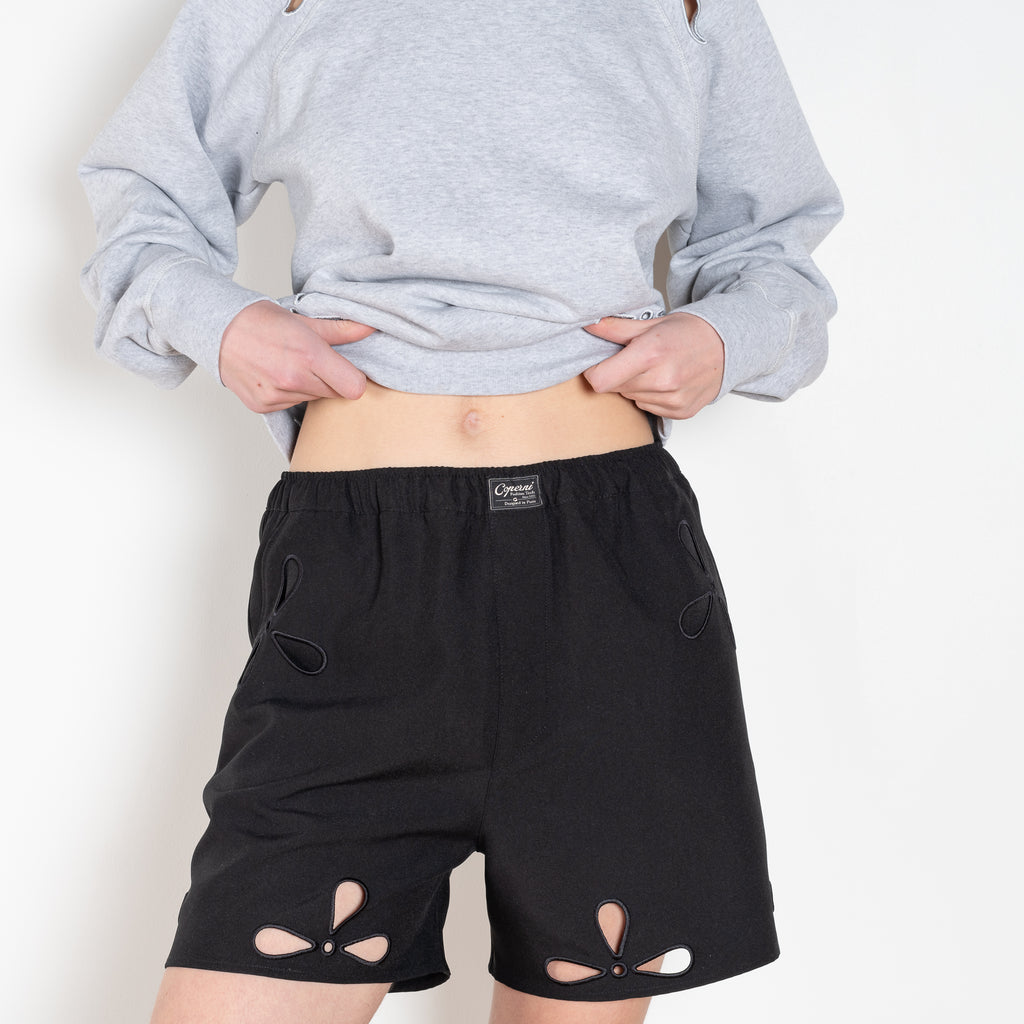 The Petal Embroidered Shorts by Coperni are boxer inspired shorts with a coperni logo patch and seasonal petal cut-outs