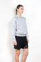 The Petal Embroidered Sweater by Coperni is a relaxed sweater with a small Coperni logo and seasonal petal cut-outs