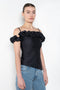 The Ruffle Top by Coperni is a fitted off-the-shoulder top with a ruffle neckline