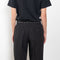 The Studded Tailored Trouser by Coperni is a mid rise trouser with a long wide leg and allover studs on the side and waistline