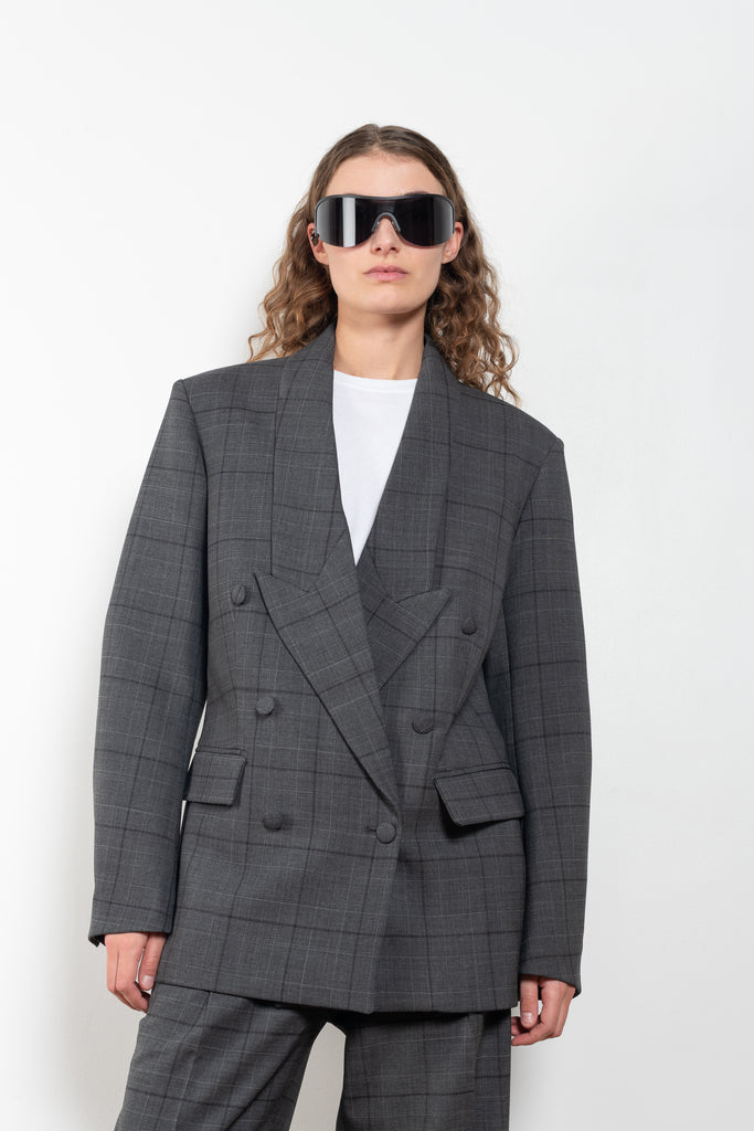 The Tailored Jacket by Coperni is a double breasted jacket with a relaxed fit in a seasonal windowpane check